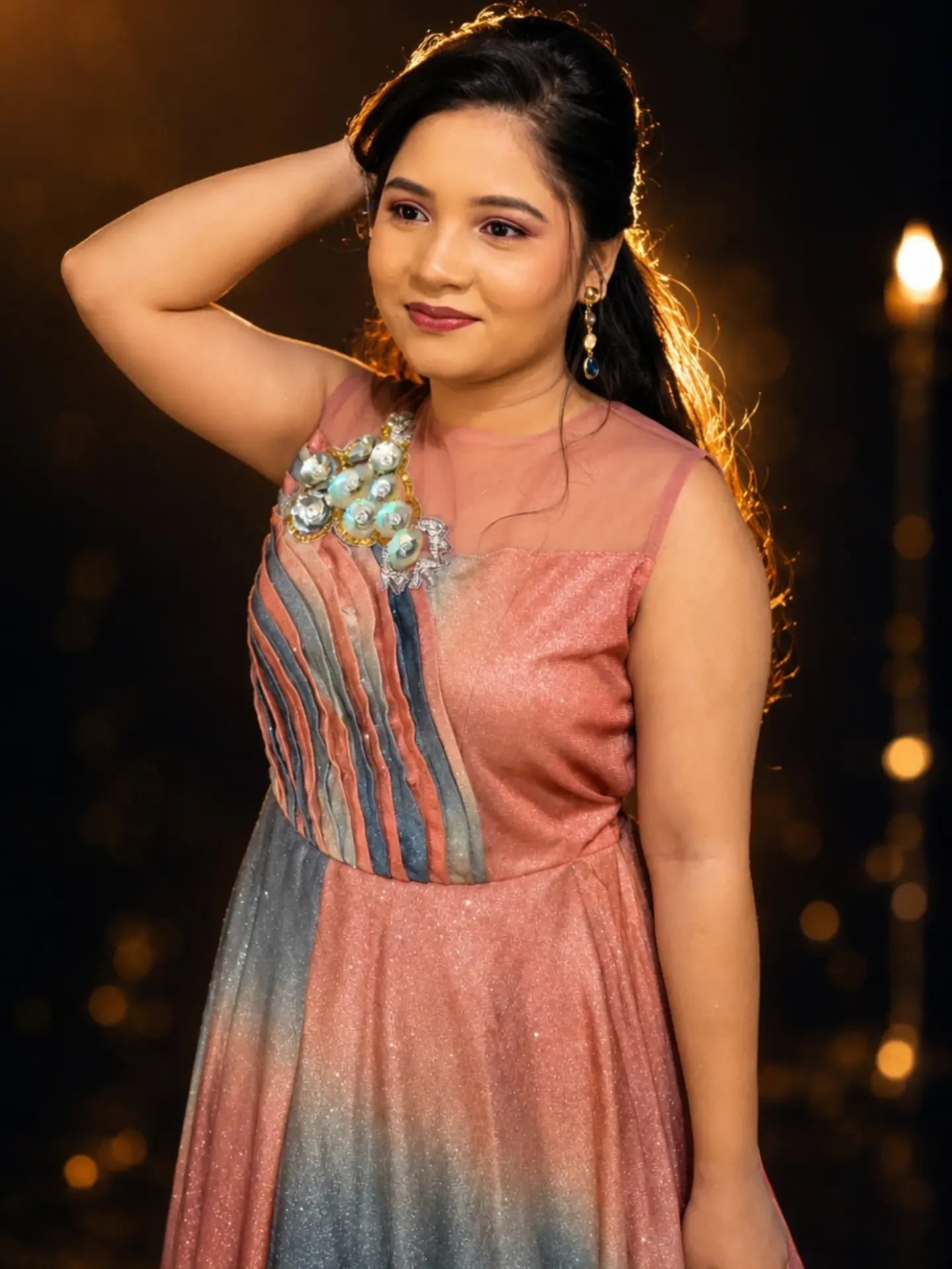 Occasion look in an ombré gown with a polished updo and a rose lip